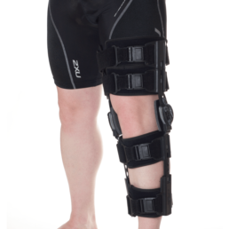 Man with black knee orthosis