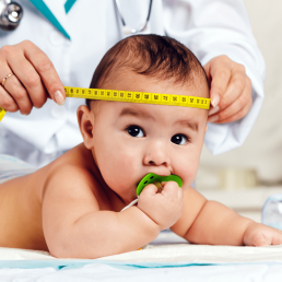 Doctor measuring a baby's head 
